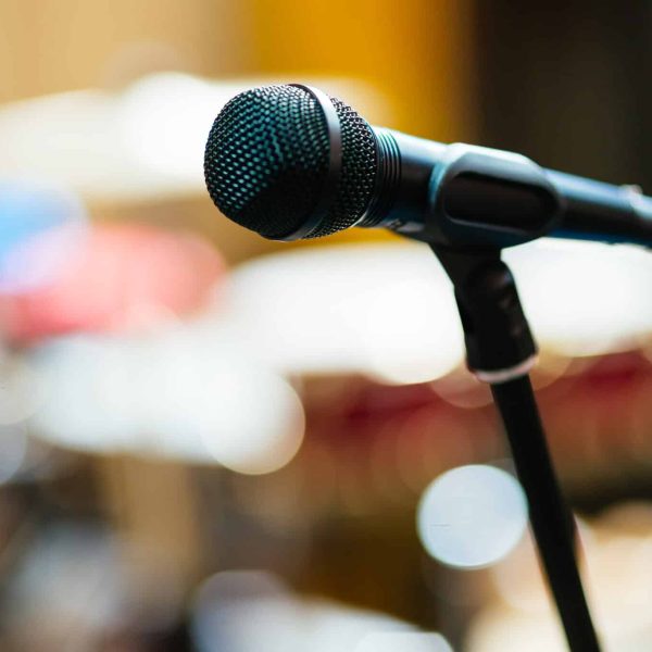 Modern and black Studio microphone in backgorund